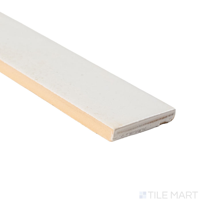 Corner shot of Bali White subway tile revealing its edge profile and luminous glossy glaze.