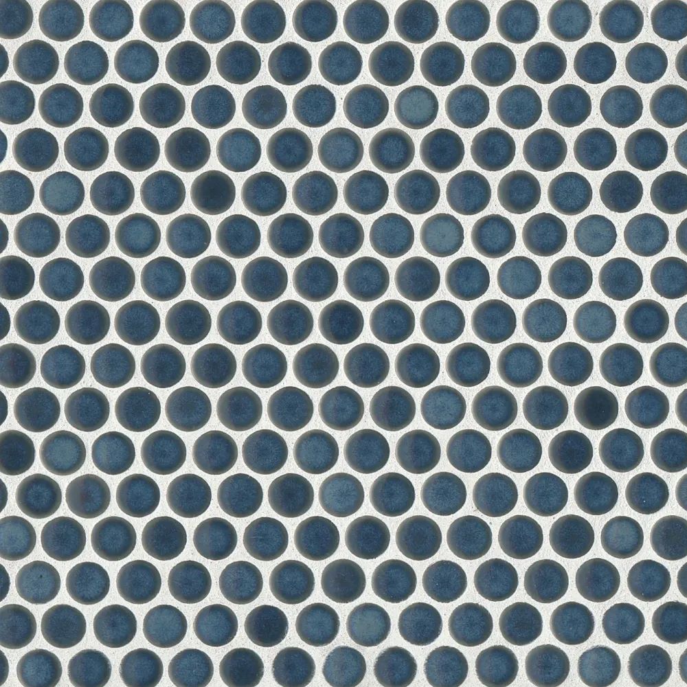 This aerial view captures the 360° Lagoon penny round tile’s deep aquatic blue tone, with a high-gloss glaze that adds a refreshing and vibrant character.