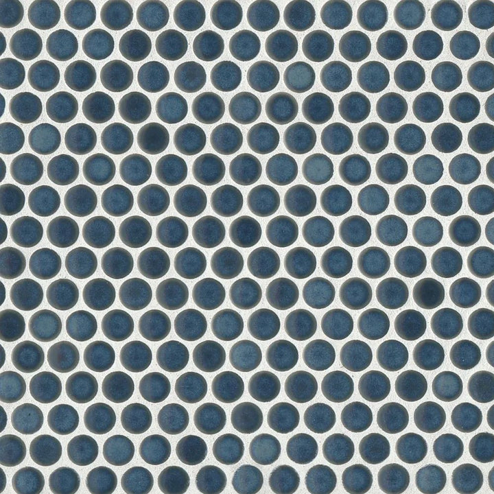 This aerial view captures the 360° Lagoon penny round tile’s deep aquatic blue tone, with a high-gloss glaze that adds a refreshing and vibrant character.