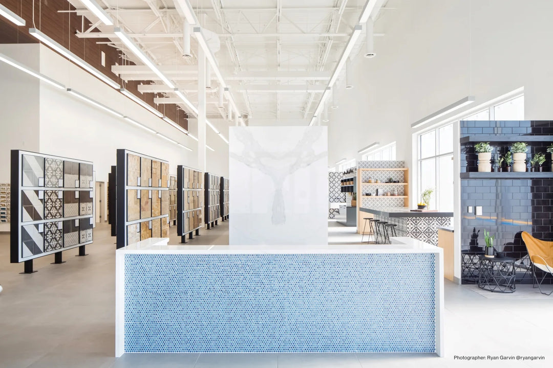 A deep lagoon blue penny round mosaic with a glossy finish adds vibrant energy and movement, creating a striking focal point with 360° Lagoon 3/4" penny round gloss glazed porcelain mosaic.