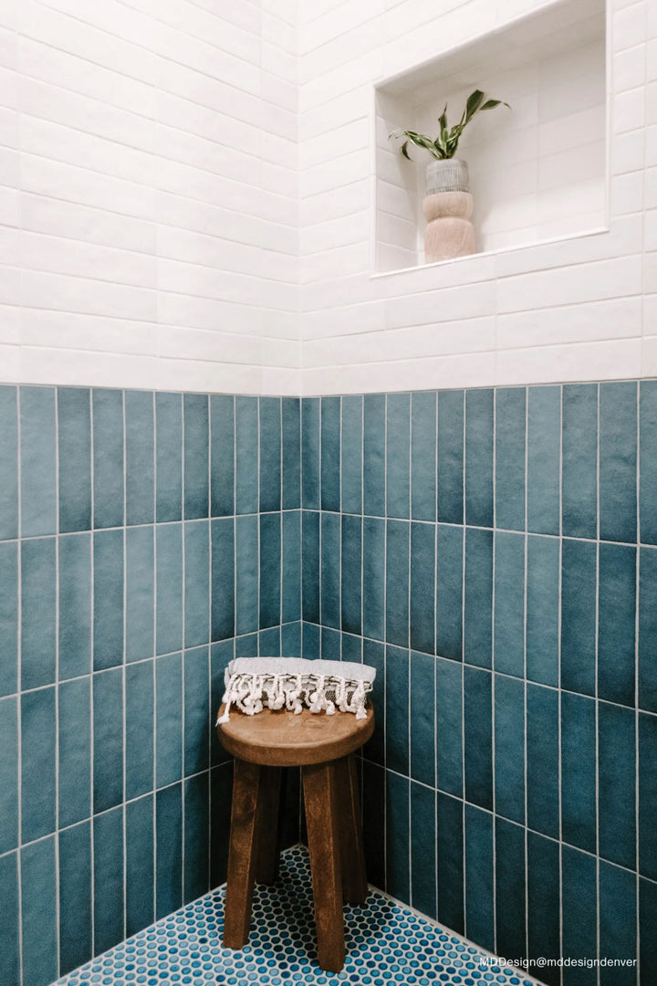 Vibrant blue penny rounds bring a refreshing coastal touch, enhancing any backsplash or shower area with the 360° Lagoon 3/4" Penny Round Gloss Glazed Porcelain Mosaic.