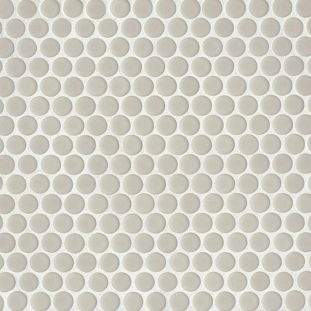 Viewed from above, the 360° Off White penny round mosaic presents a clean, subtle elegance with its luminous glossy finish, perfect for brightening up any setting.