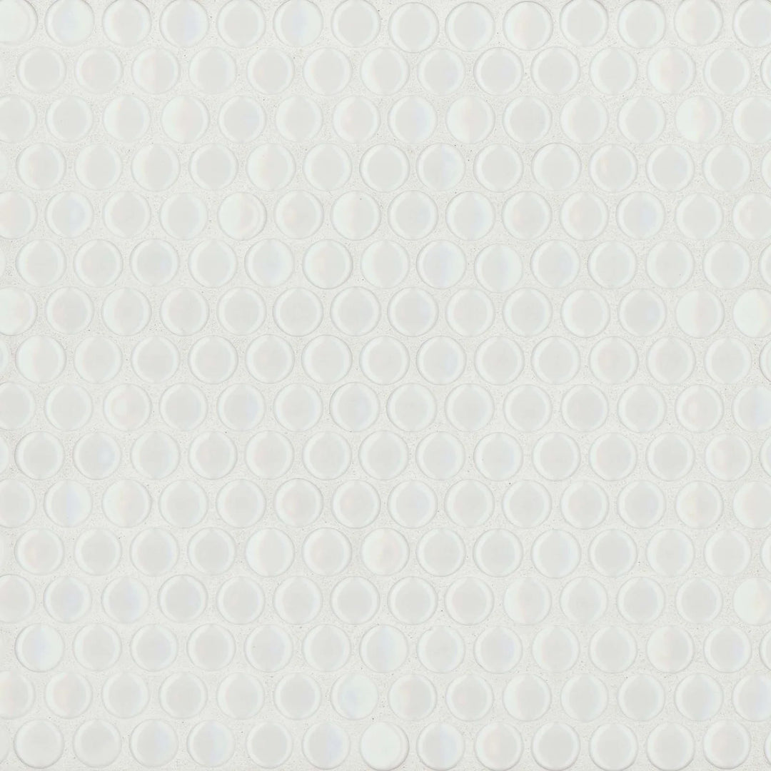 This top-down composition showcases the pristine white shade of the 360° White penny round tile, with a glossy surface that amplifies light and adds depth.