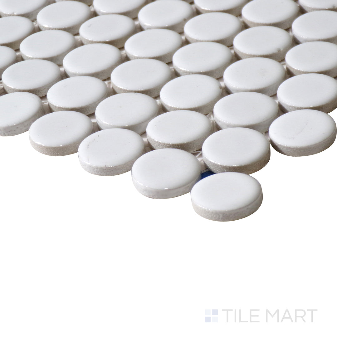 Corner-focused image of 360° White 3/4" penny round gloss glazed porcelain mosaic, emphasizing its pristine white color, polished shine, and the rounded pattern forming a structured transition.