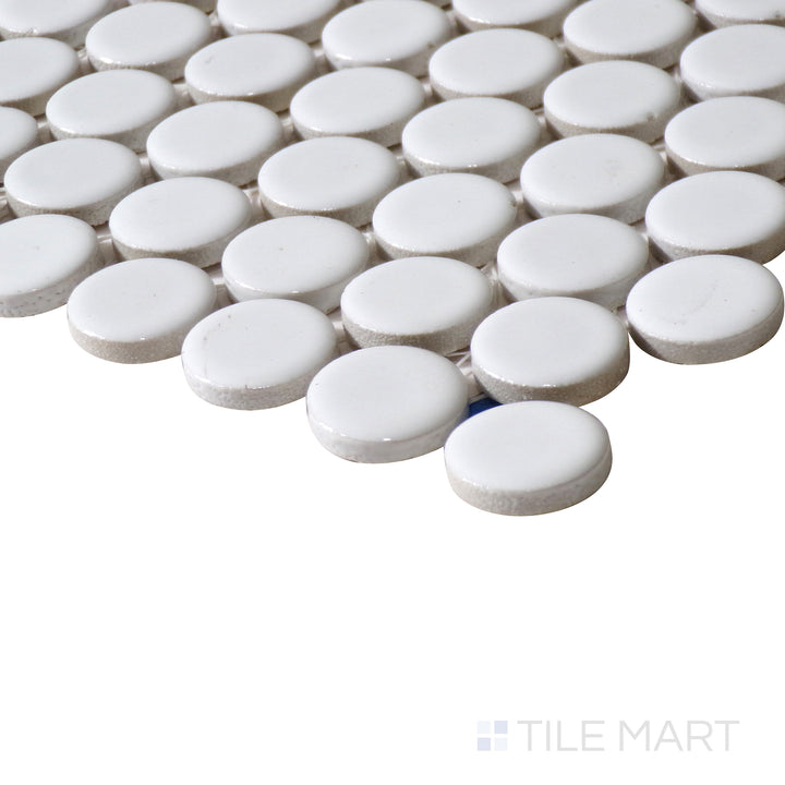 Corner-focused image of 360° White 3/4" penny round gloss glazed porcelain mosaic, emphasizing its pristine white color, polished shine, and the rounded pattern forming a structured transition.
