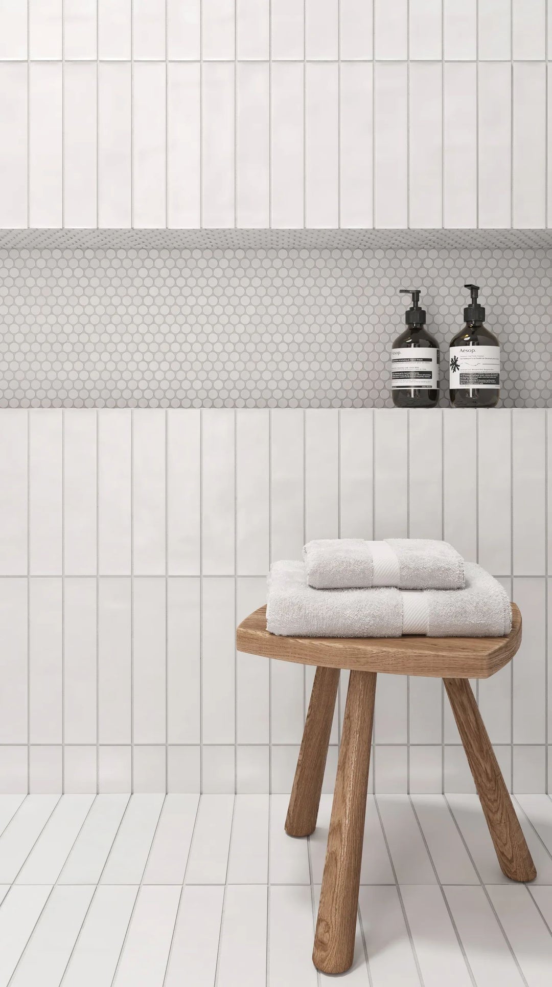 A classic white penny round mosaic with a high-gloss surface reflects light beautifully, bringing timeless elegance with 360° White 3/4" penny round gloss glazed porcelain mosaic.