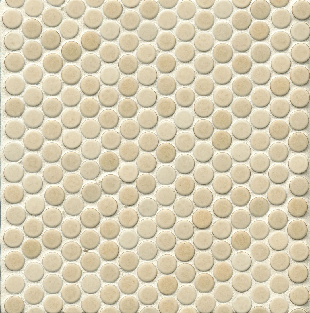 From a top-down angle, this 360° Beige penny round tile reveals its warm, neutral tones and velvety matte glaze, creating a natural, organic aesthetic.