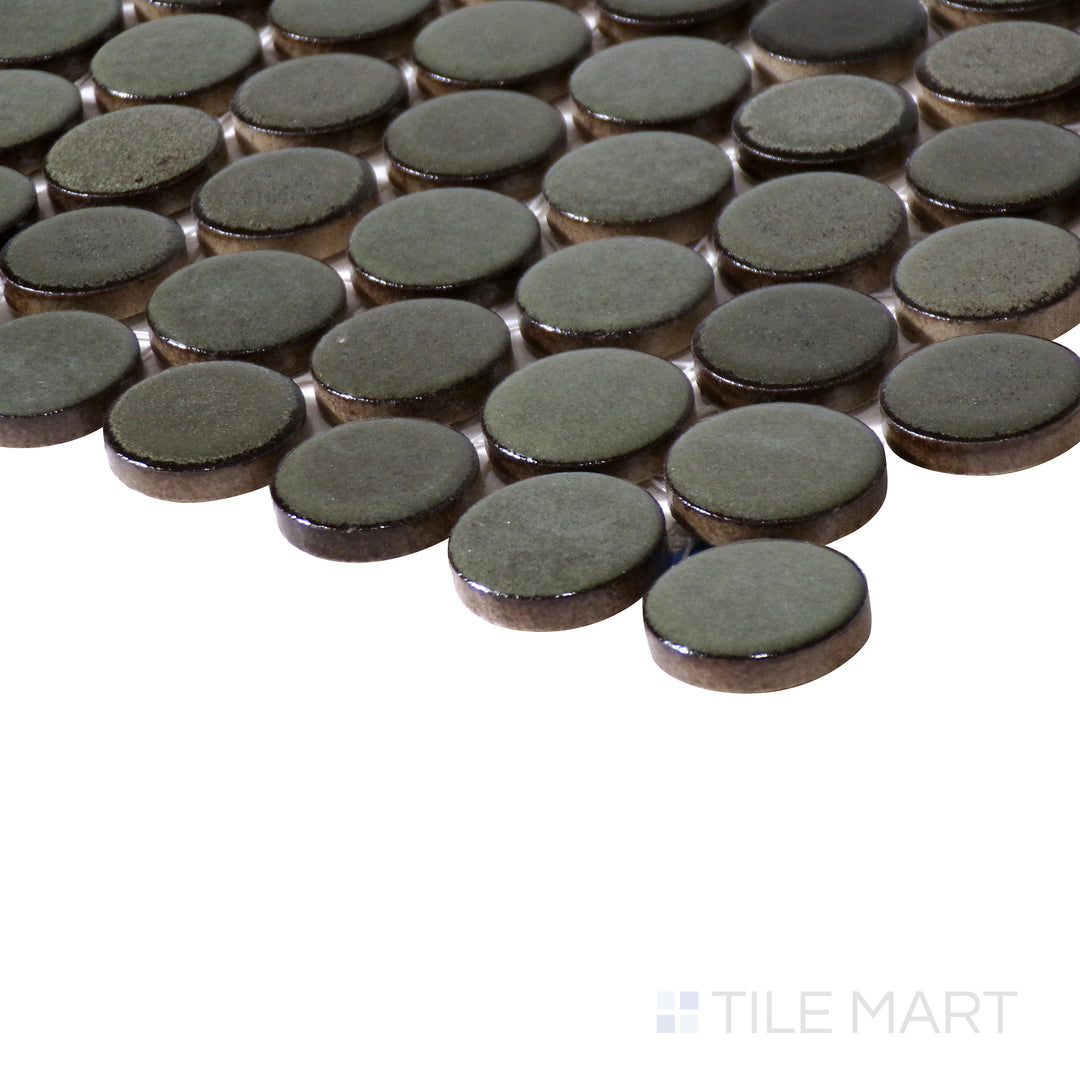 Side-angle close-up of 360° Shale 3/4" penny round matte glazed porcelain mosaic, focusing on its muted earthy hue, softly diffused surface, and carefully arranged edges forming a clean intersection.
