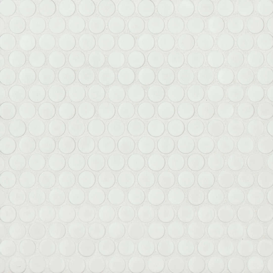 This top-view shot of the 360° White penny round tile emphasizes its crisp white color and subtle matte finish, offering a timeless, understated elegance.