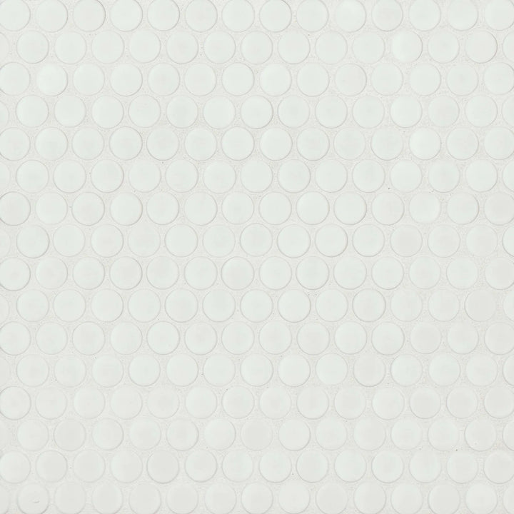 This top-view shot of the 360° White penny round tile emphasizes its crisp white color and subtle matte finish, offering a timeless, understated elegance.