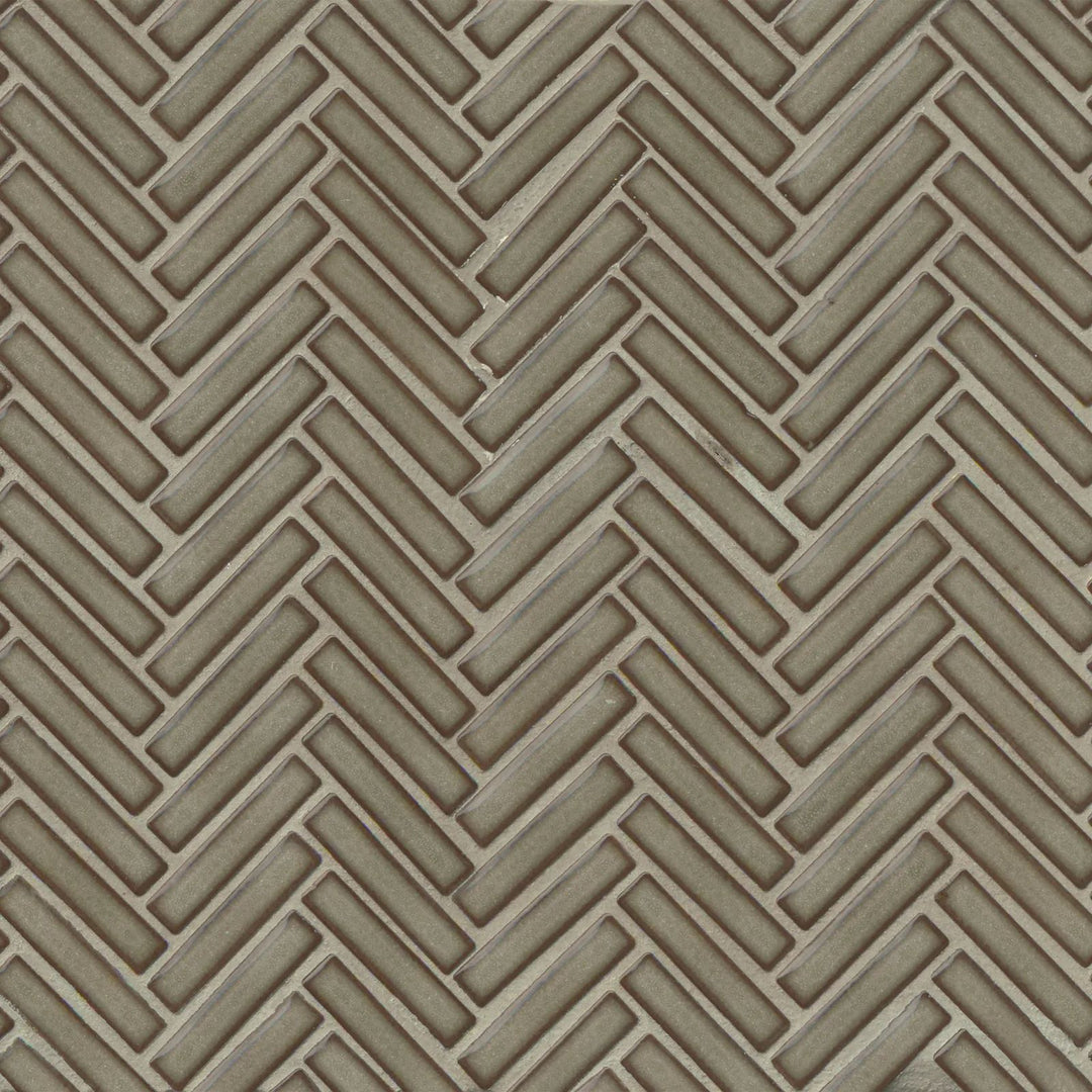 Captured from above, the 90° Gray Haze Herringbone mosaic showcases its soft gray tones and high-gloss finish, creating a refined and contemporary appeal.
