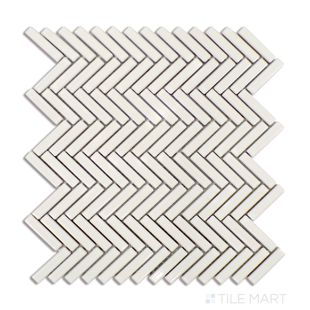 A finely detailed close-up of 90° Off White Herringbone Gloss Glazed Porcelain Mosaic tile reveals its soft off-white tone and luminous glaze, enhancing the classic herringbone design.