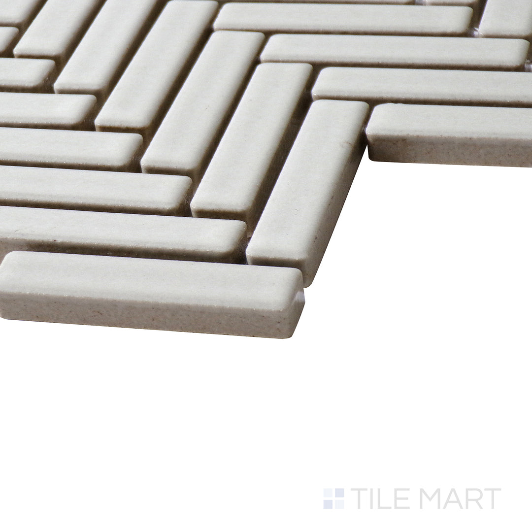 Side-angle perspective of 90° Off White Herringbone gloss glazed porcelain mosaic, featuring a neutral off-white tone, glossy surface, and seamless corner transition.