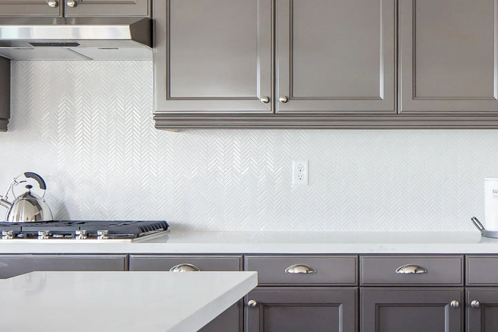A sophisticated and classic pattern with a high-end glossy sheen, featuring 90° White Herringbone Gloss Glazed Porcelain Mosaic.