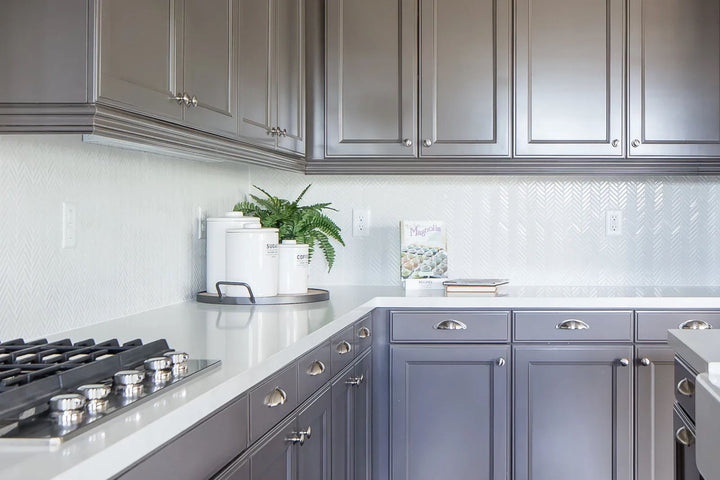 An elegant and dynamic look achieved with 90° White Herringbone Gloss Glazed Porcelain Mosaic, bringing classic patterning with a reflective surface to brighten interiors.