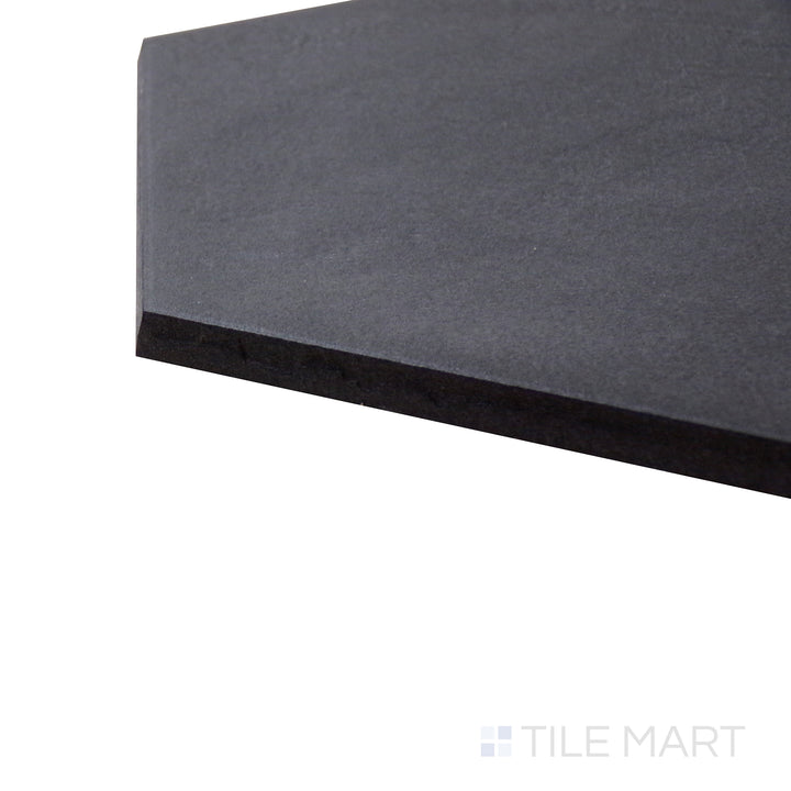 Angled shot of Allora Black 8.5x10 matte glazed porcelain tile, displaying its dark aesthetic, sharp edges, and velvety matte surface creating a seamless transition at the corner.