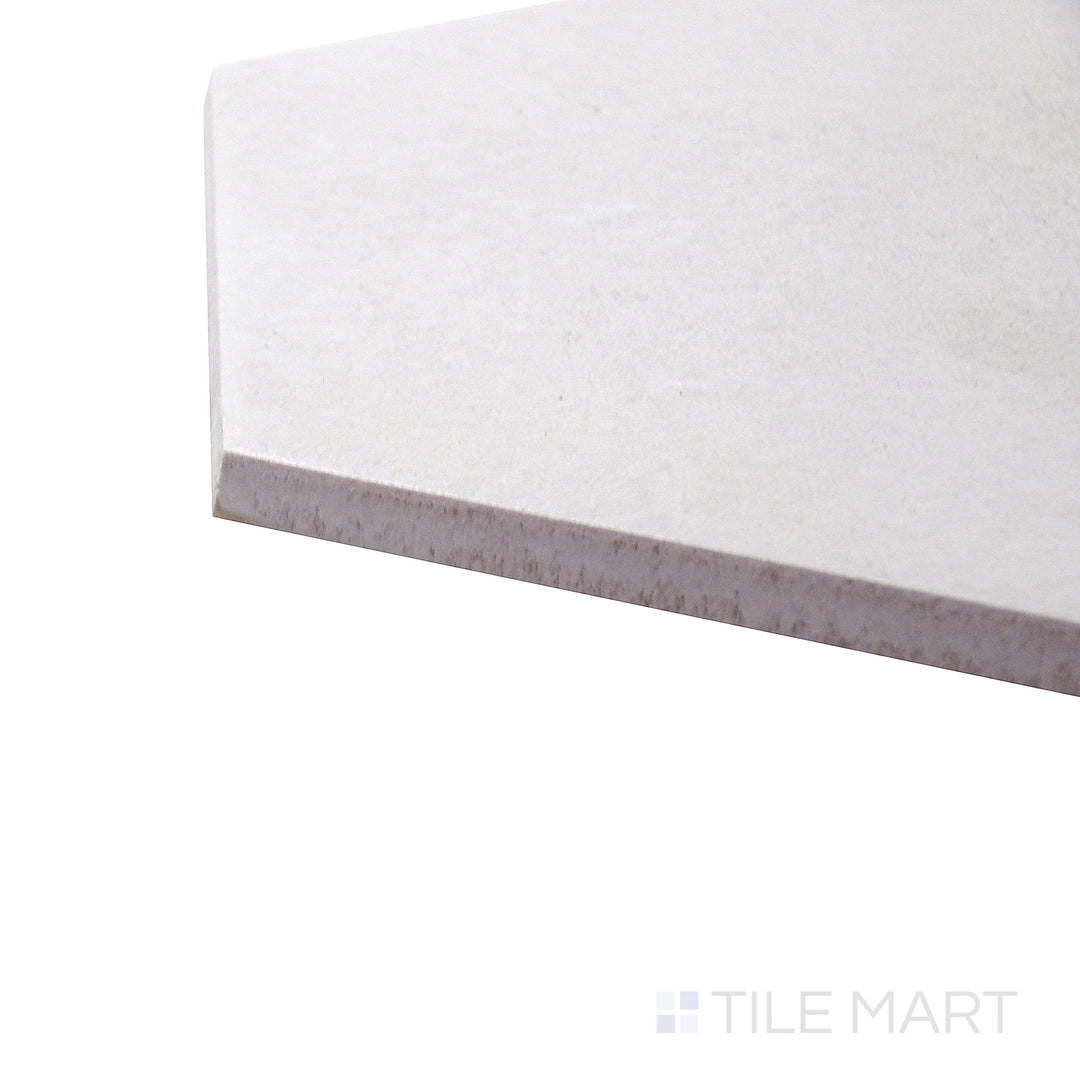 Side-corner view of Allora White 8.5x10 matte glazed porcelain tile, drawing attention to its crisp white tone, finely detailed edges, and soft matte surface.