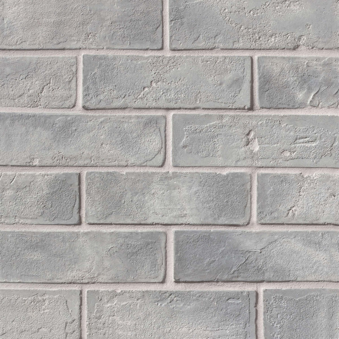 Captured from above, the Avondale Sidewalk 2x8 matte brick tile presents a subtle blend of neutral tones, delivering a versatile, urban-inspired look with a textured matte feel.