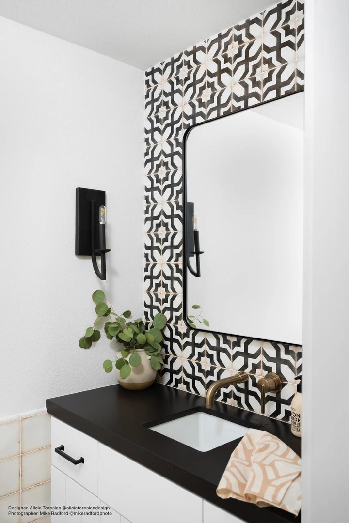 A decorative matte glazed ceramic tile, Casablanca Farissi 5x5 showcases bold geometric patterns with a vintage charm.