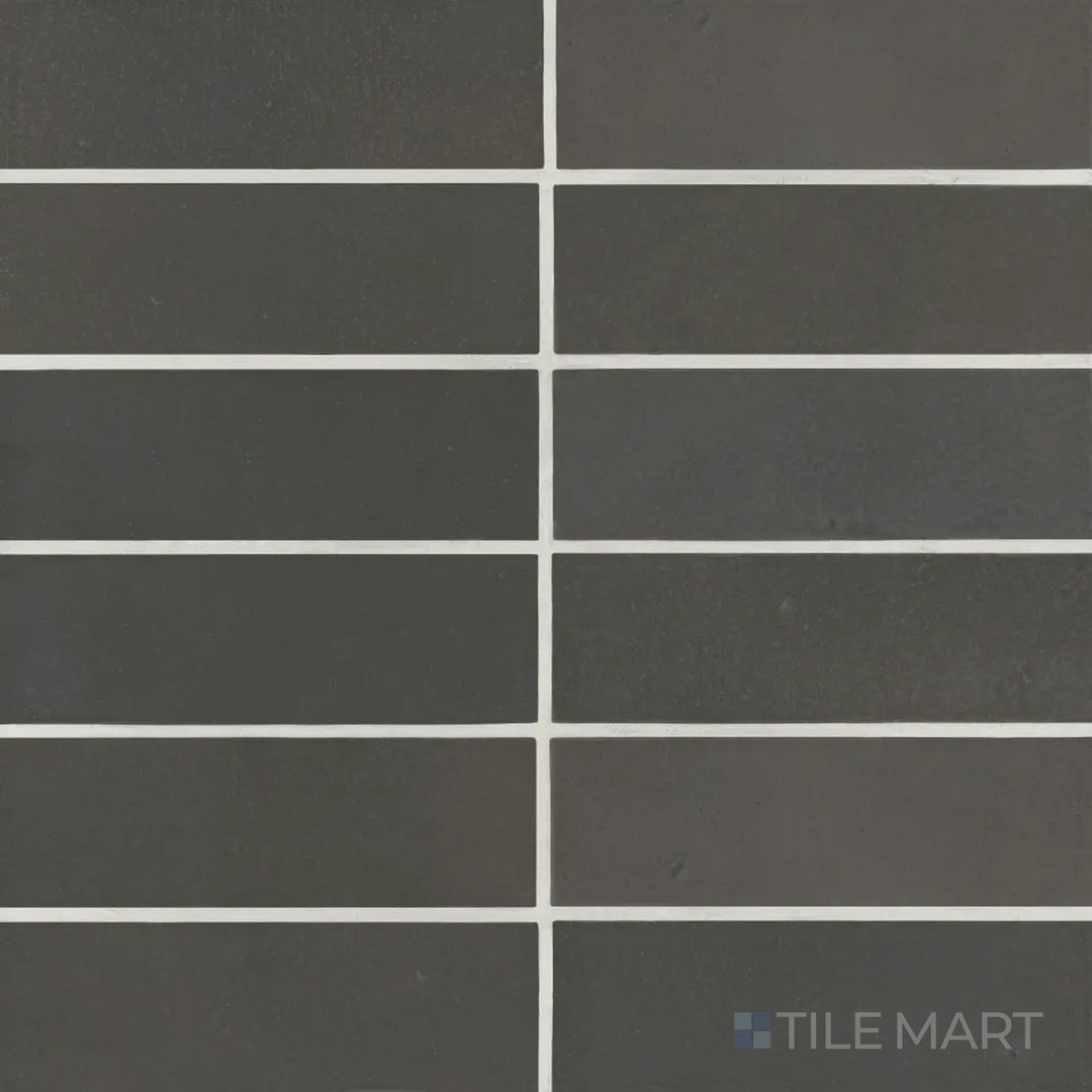 A top-down view of the Celine Black 2x6 matte glazed porcelain tile showcases its deep, rich black tone with a soft matte finish, adding sophistication to any space.