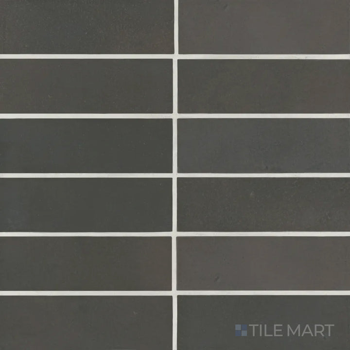 A top-down view of the Celine Black 2x6 matte glazed porcelain tile showcases its deep, rich black tone with a soft matte finish, adding sophistication to any space.