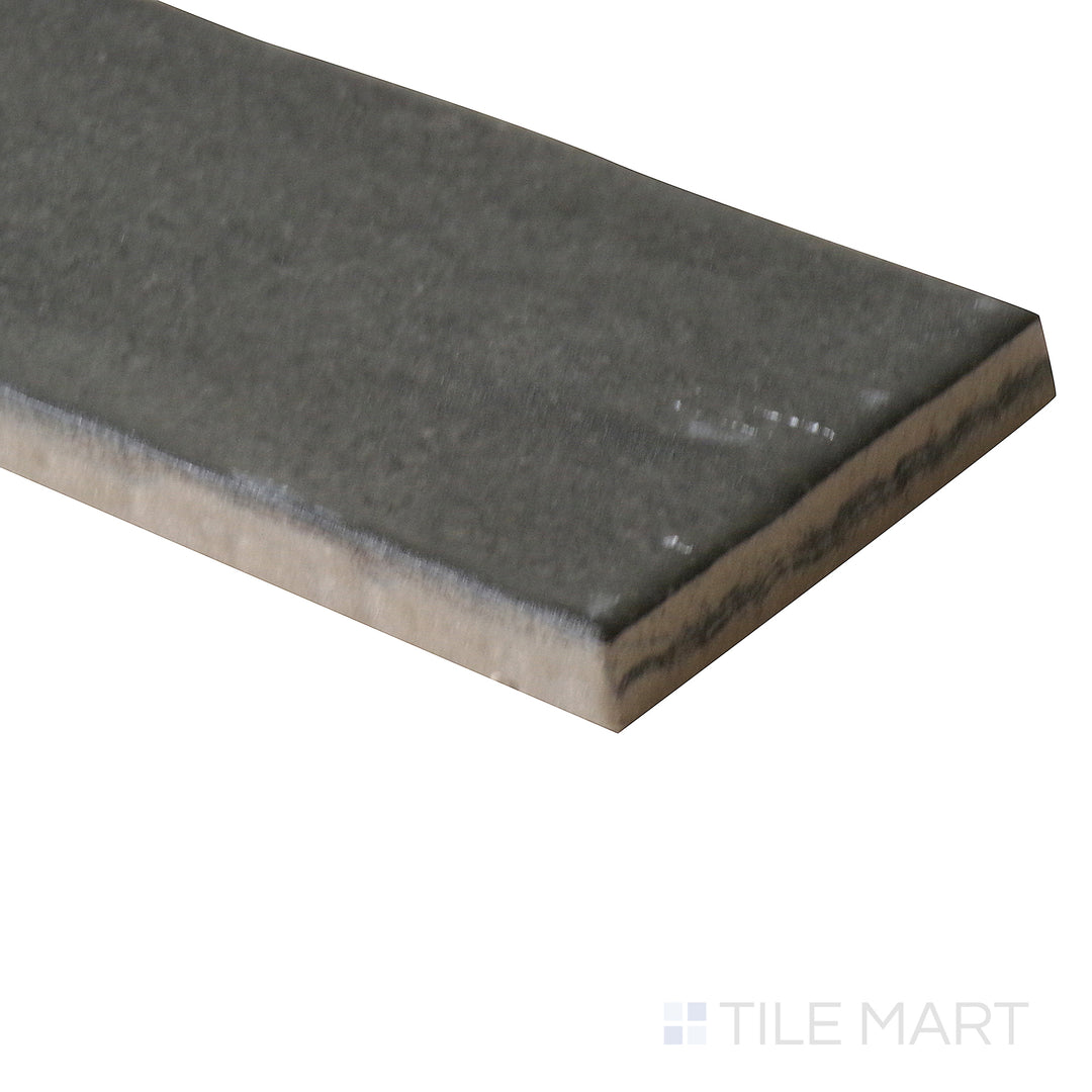 Corner shot of Celine Black 2x6 matte glazed porcelain tile, showcasing its deep black tone, fine matte surface, and the precise meeting of its sharp edges.