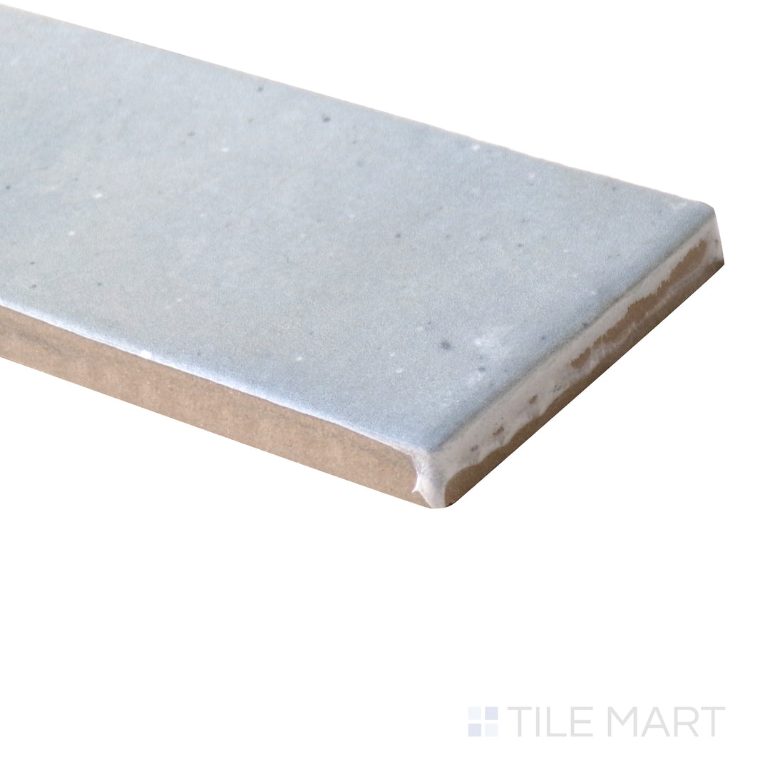 Angled close-up of Celine Blue 2x6 matte glazed porcelain tile, featuring a rich blue shade, smooth matte texture, and the seamless way its edges form a crisp corner.