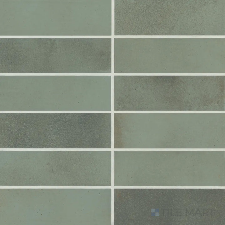 An overhead shot of the Celine Sage 2x6 matte glazed porcelain tile reveals a soothing green hue with a muted matte texture, creating a fresh and organic feel.