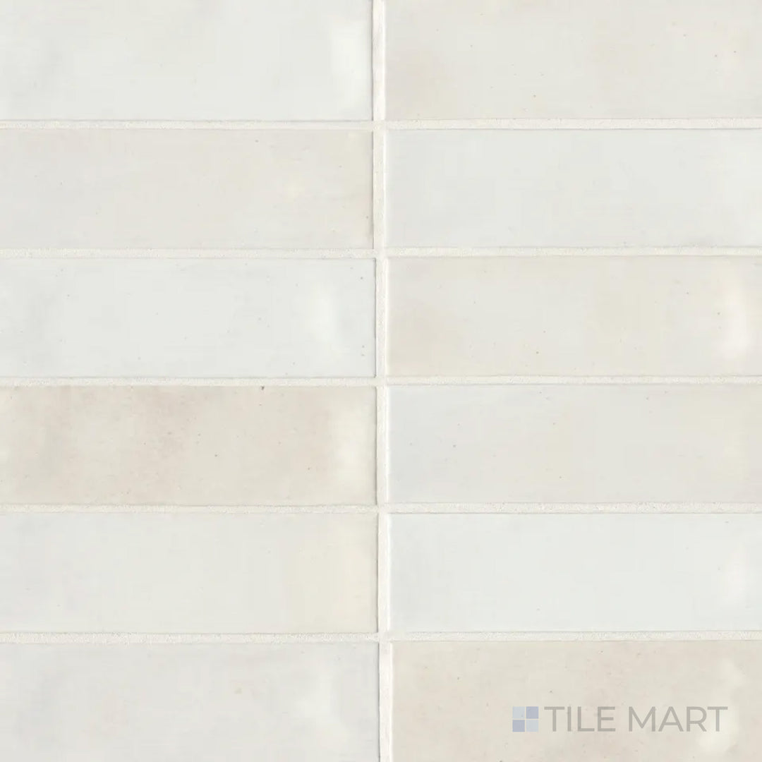 Captured from above, the Celine White 2x6 gloss glazed porcelain tile reflects light beautifully with its pristine white finish and high-gloss surface, enhancing brightness.