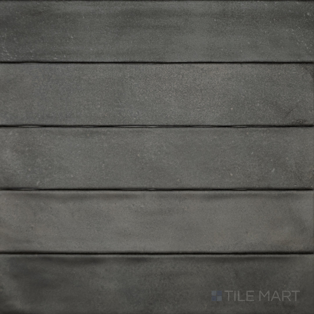 A top-down perspective of the Celine Black 2.5x12 matte glazed porcelain tile highlights its elongated shape and deep black tone with a smooth matte texture.