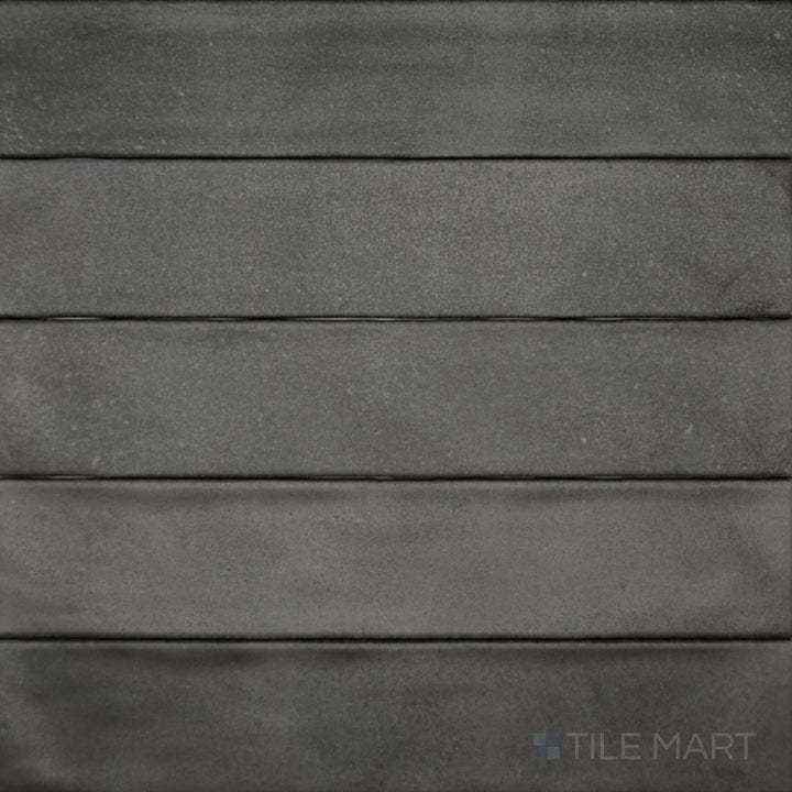 A top-down perspective of the Celine Black 2.5x12 matte glazed porcelain tile highlights its elongated shape and deep black tone with a smooth matte texture.