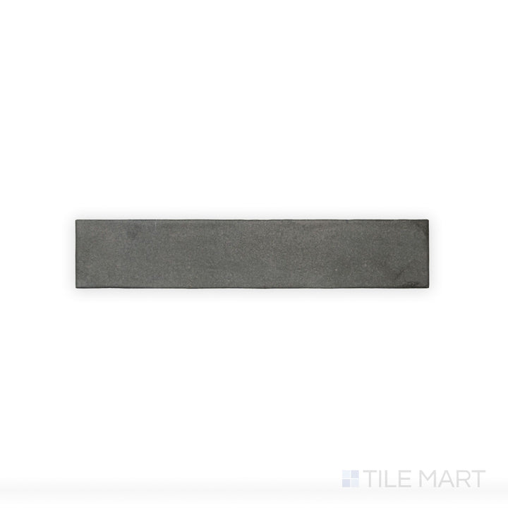 This close-up view of Celine Black 2.5X12 Matte Glazed Porcelain tile highlights its rich black color and understated matte glaze, ideal for creating bold contrasts.