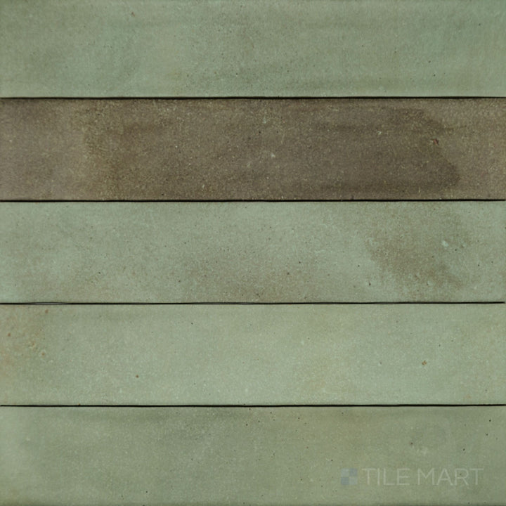 An aerial perspective of the Celine Sage 2.5x12 matte glazed porcelain tile showcases its soft green hue with a muted matte finish, adding a calming and natural ambiance.