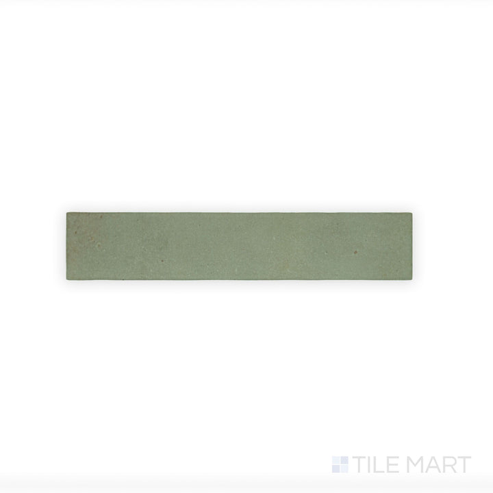 A macro view of Celine Sage 2.5X12 Matte Glazed Porcelain tile highlights its soft green hue and matte finish, adding a subtle, organic element to any space.