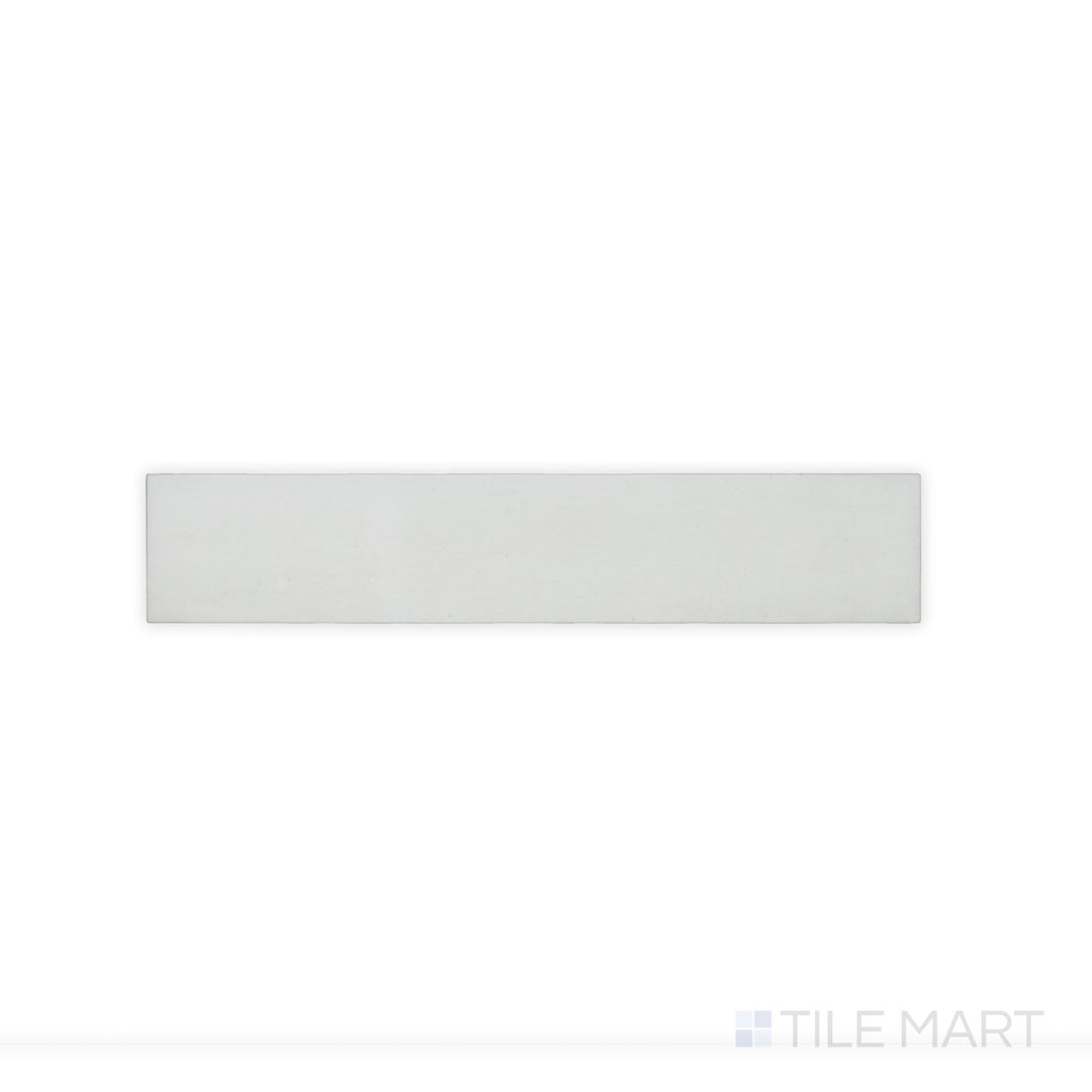 This close-up shot of Celine White 2.5X12 Matte Glazed Porcelain tile emphasizes its clean white color and smooth matte finish, ideal for bright and airy designs.