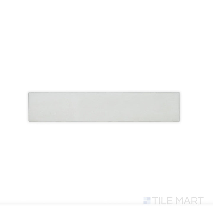 This close-up shot of Celine White 2.5X12 Matte Glazed Porcelain tile emphasizes its clean white color and smooth matte finish, ideal for bright and airy designs.