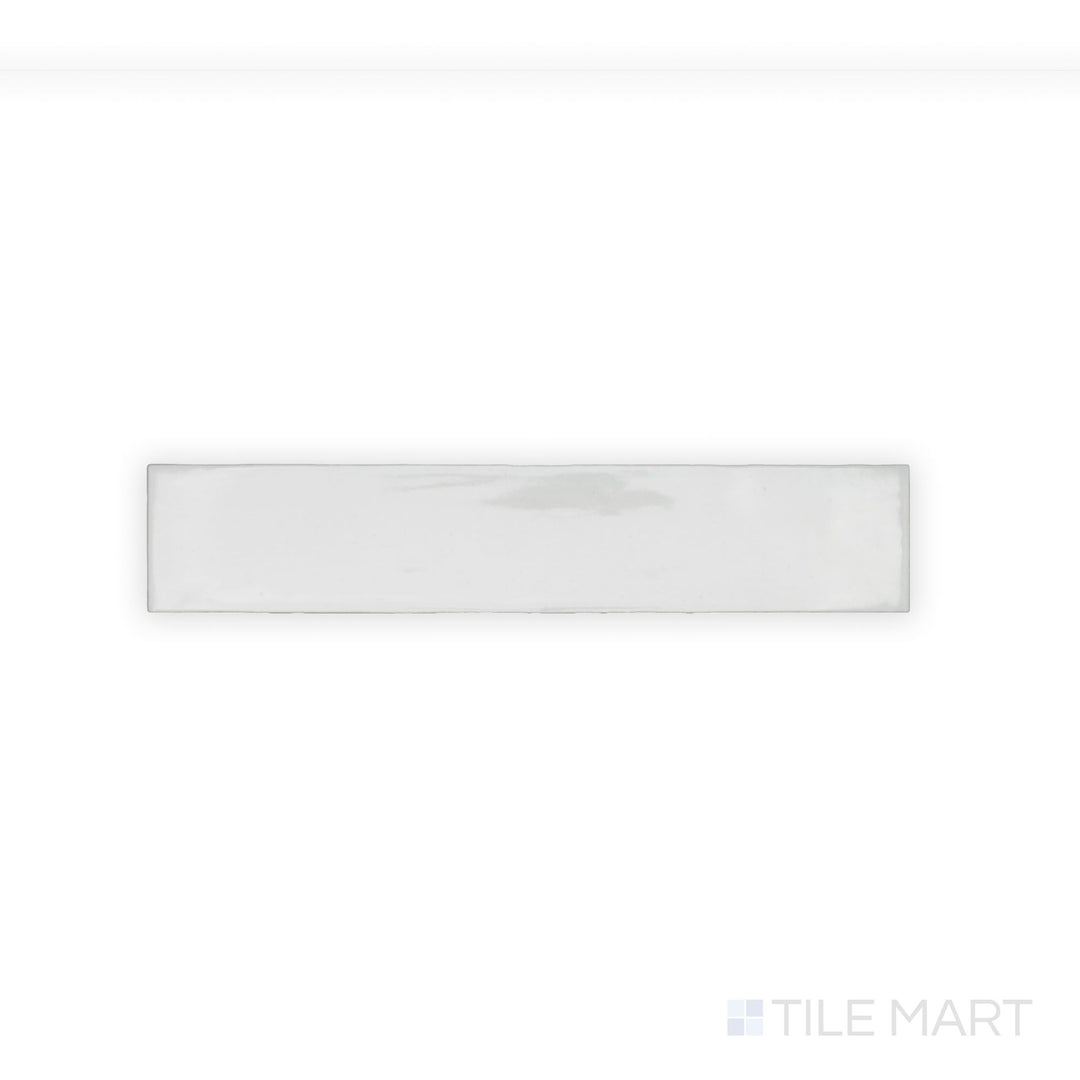 A finely detailed close-up of Celine White 2.5X12 Gloss Glazed Porcelain tile showcases its pristine white shade and high-gloss surface, adding a reflective and polished touch.