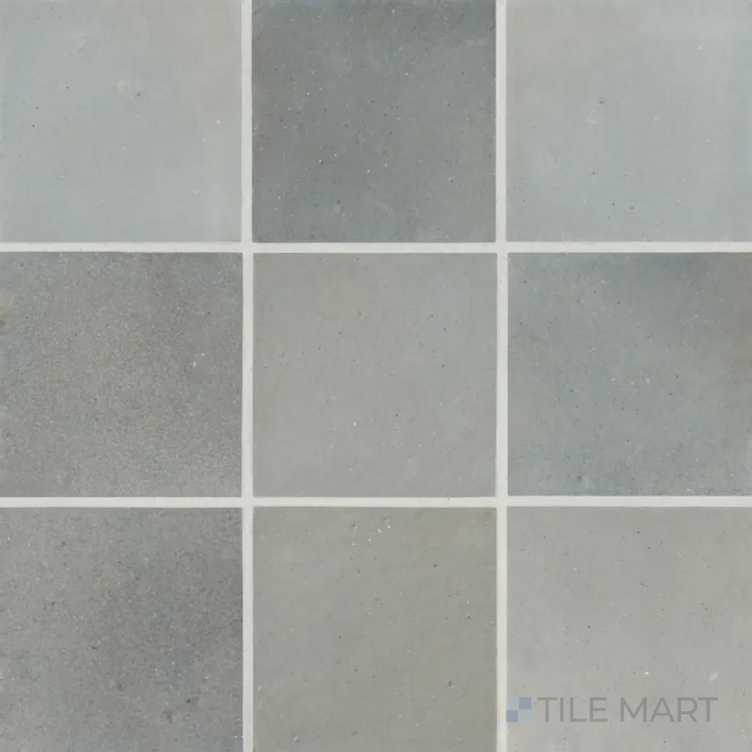 A top-down shot of the Celine Blue 4x4 matte glazed porcelain tile showcases its rich blue hue with a smooth matte finish, making a striking statement in any design.