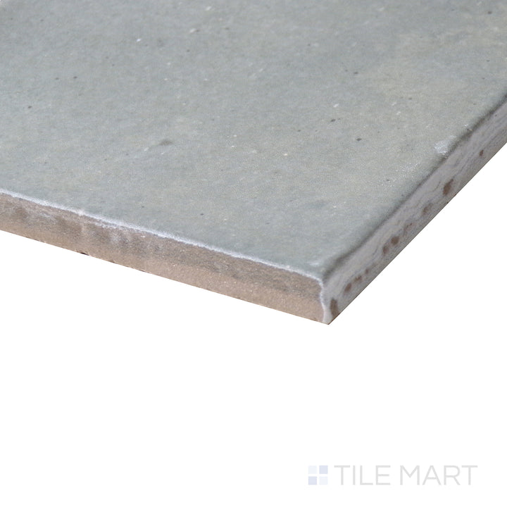 Angled close-up of Celine Blue 4x4 matte glazed porcelain tile, showcasing its vibrant blue shade, crisp matte finish, and the structured corner formation where edges meet.