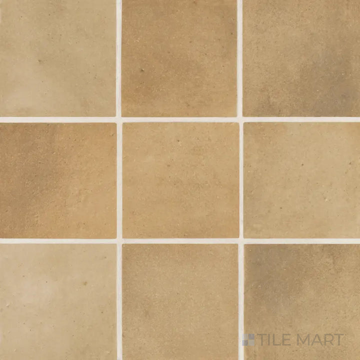 An overhead view of the Celine Cotto 4x4 matte glazed porcelain tile reveals its warm terracotta-inspired hue with a smooth matte finish, adding rustic charm to any space.