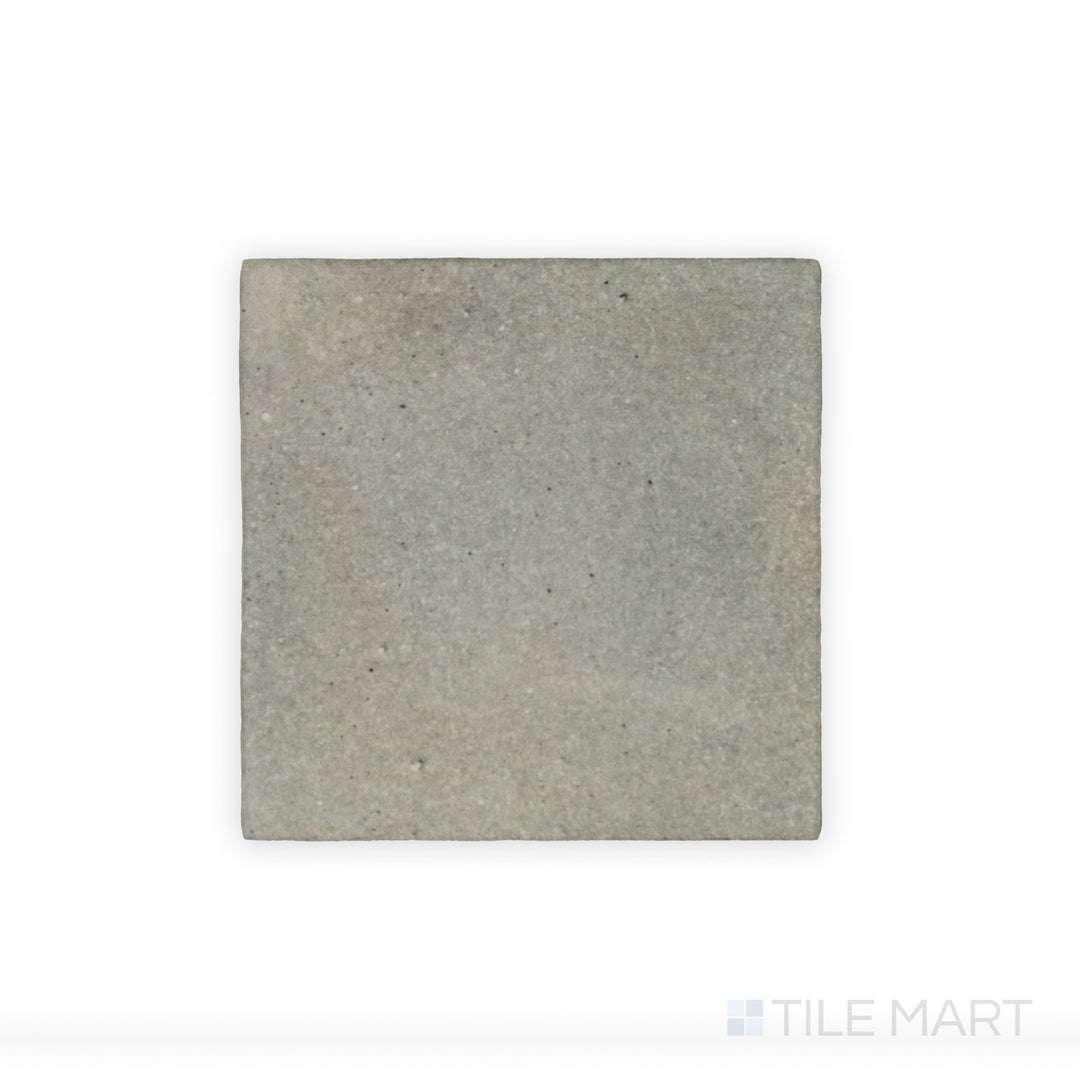 This close-up shot of Celine Greige 4X4 Matte Glazed Porcelain tile showcases its neutral greige tone and smooth matte surface, making it a versatile choice for modern interiors.