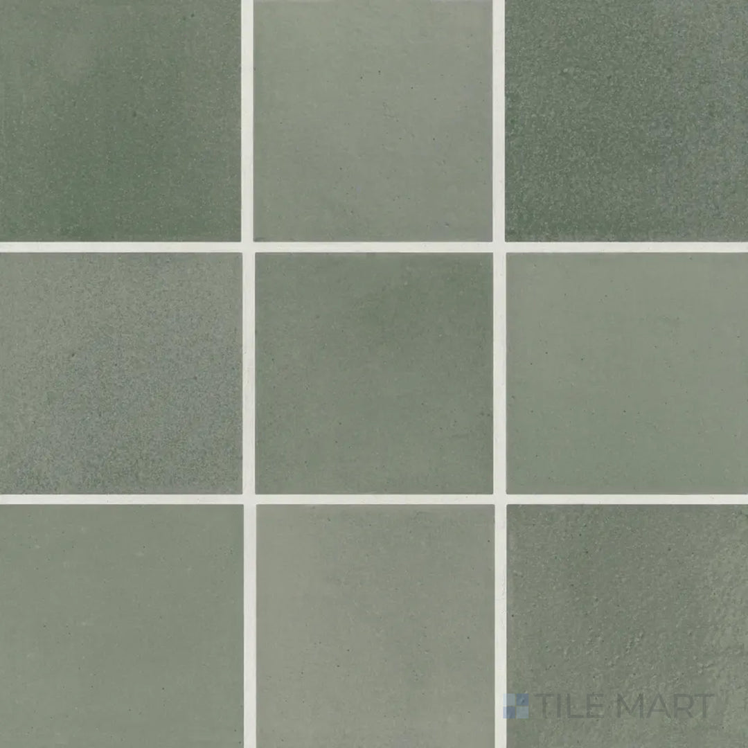 An aerial shot of the Celine Sage 4x4 matte glazed porcelain tile highlights its delicate green hue with a matte glaze, creating a serene and nature-inspired ambiance.