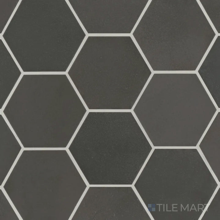 Aerial view of the Celine Black 4" hex matte glazed porcelain tile highlights its striking black tone in a geometric hexagonal shape, delivering bold contemporary style.