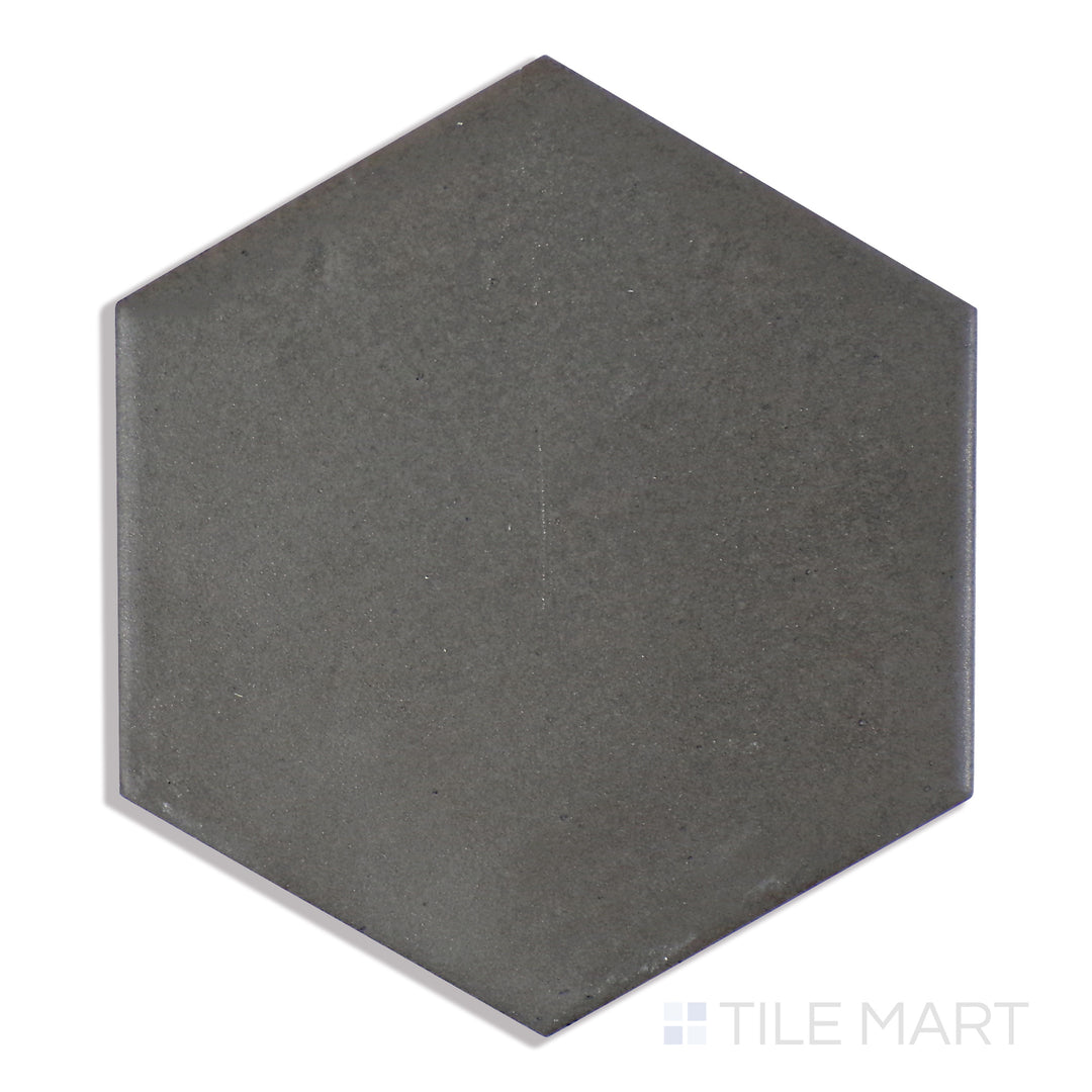 A detailed close-up of Celine Black 4" Hex Matte Glazed Porcelain tile highlights its bold black color and velvety matte surface, ideal for striking modern designs.