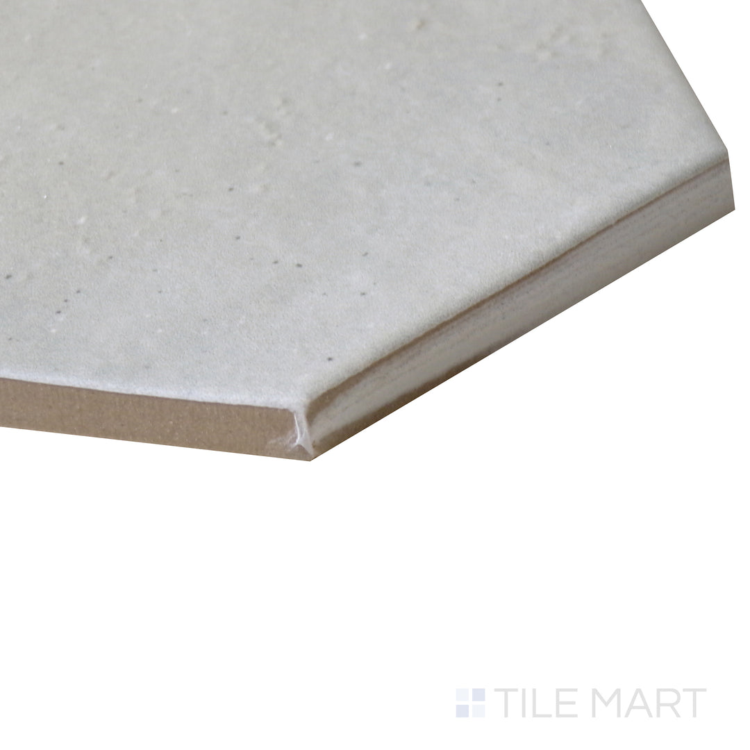 Angled view of Celine Blue 4" hex matte glazed porcelain tile, drawing attention to its rich blue tone, crisp hexagonal edges, and structured matte surface.