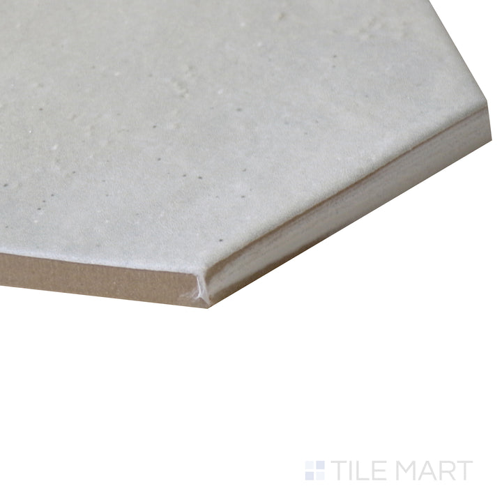 Angled view of Celine Blue 4" hex matte glazed porcelain tile, drawing attention to its rich blue tone, crisp hexagonal edges, and structured matte surface.