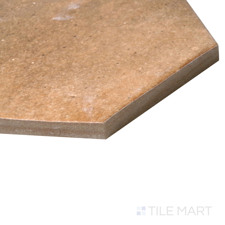 Side-angle close-up of Celine Cotto 4" hex matte glazed porcelain tile, featuring its earthy terracotta hue, clean geometric layout, and fine matte texture blending seamlessly at the corner.