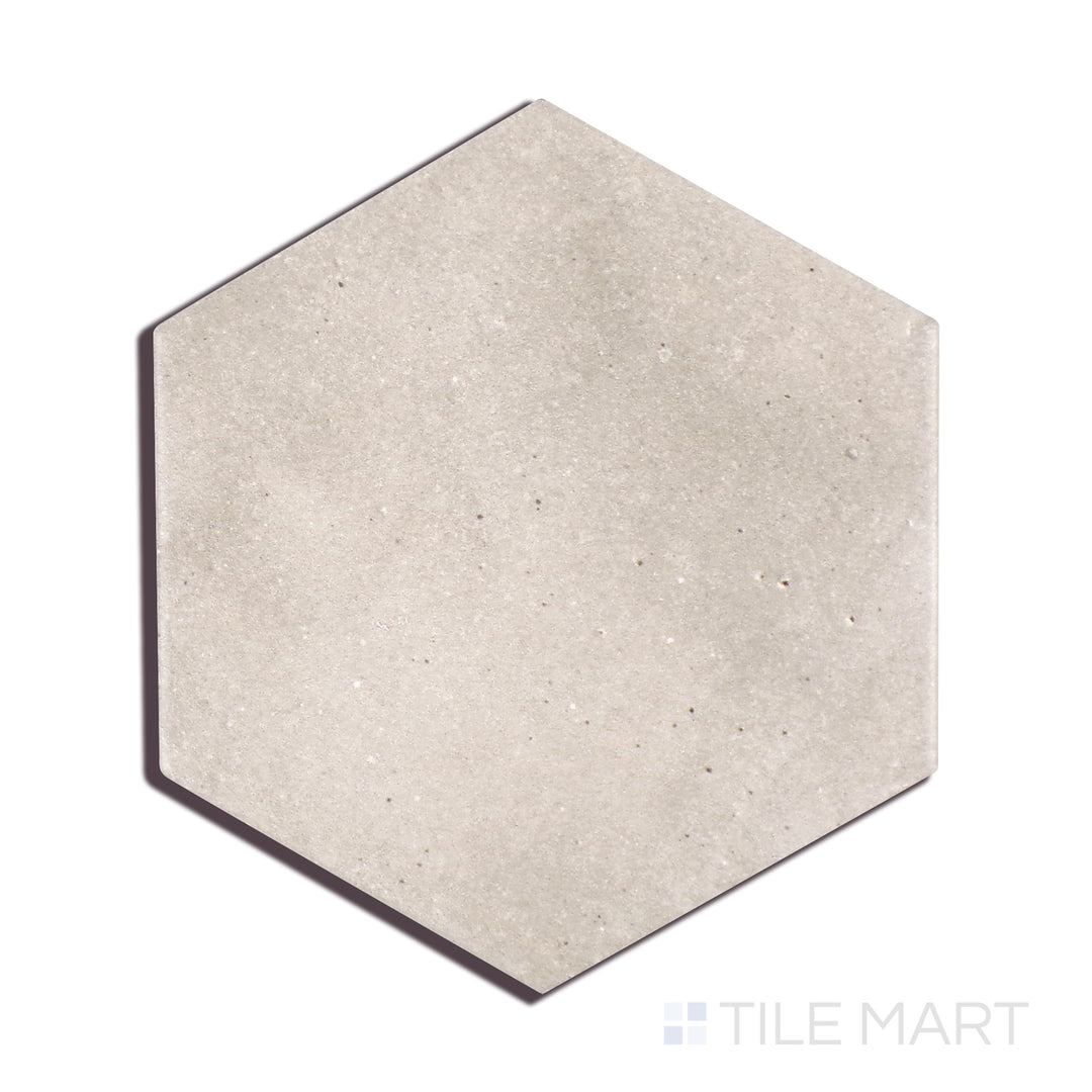 A finely detailed view of Celine Greige 4" Hex Matte Glazed Porcelain tile highlights its balanced greige tone and velvety matte surface, blending warmth with modern elegance.