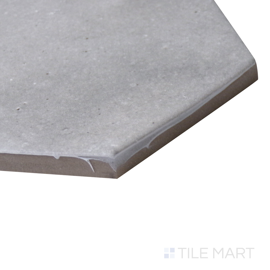 Corner-focused image of Celine Greige 4" hex matte glazed porcelain tile, displaying its versatile greige tone, well-defined hexagonal edges, and soft matte finish.