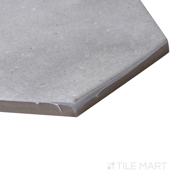 Corner-focused image of Celine Greige 4" hex matte glazed porcelain tile, displaying its versatile greige tone, well-defined hexagonal edges, and soft matte finish.